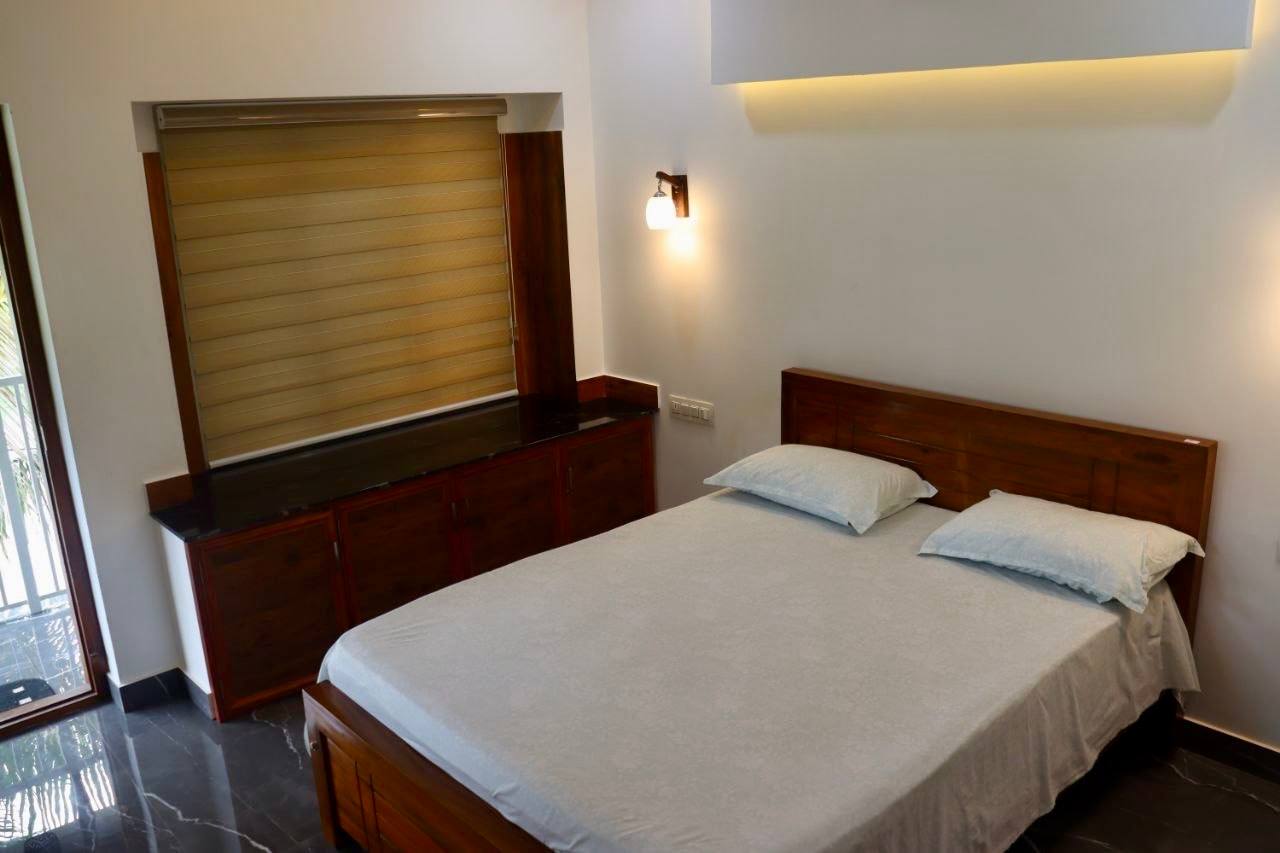 Bedroom inside the 3 BHK Ten One Resort property in Calicut